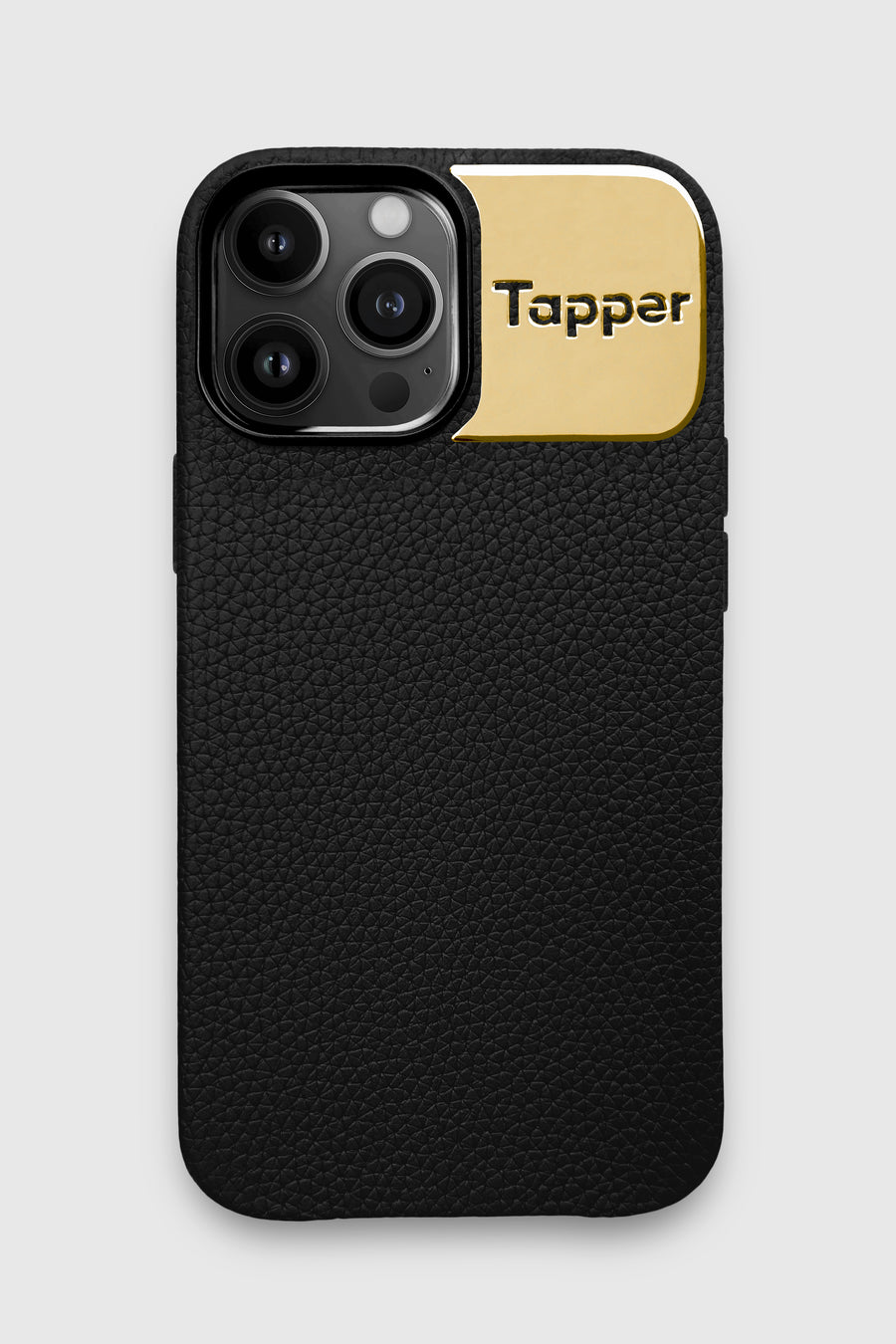 Tapper's luxurious black genuine cow leather iPhone 13 Pro Max case with MagSafe and a metal logo plate in 18k gold plating that protects and elevates the look of your iPhone 13 Pro. The next must-have high end protective Apple iPhone accessory in real leather and precious metals. Designed in Sweden by Tapper. Free Express Shipping at gettapper.com