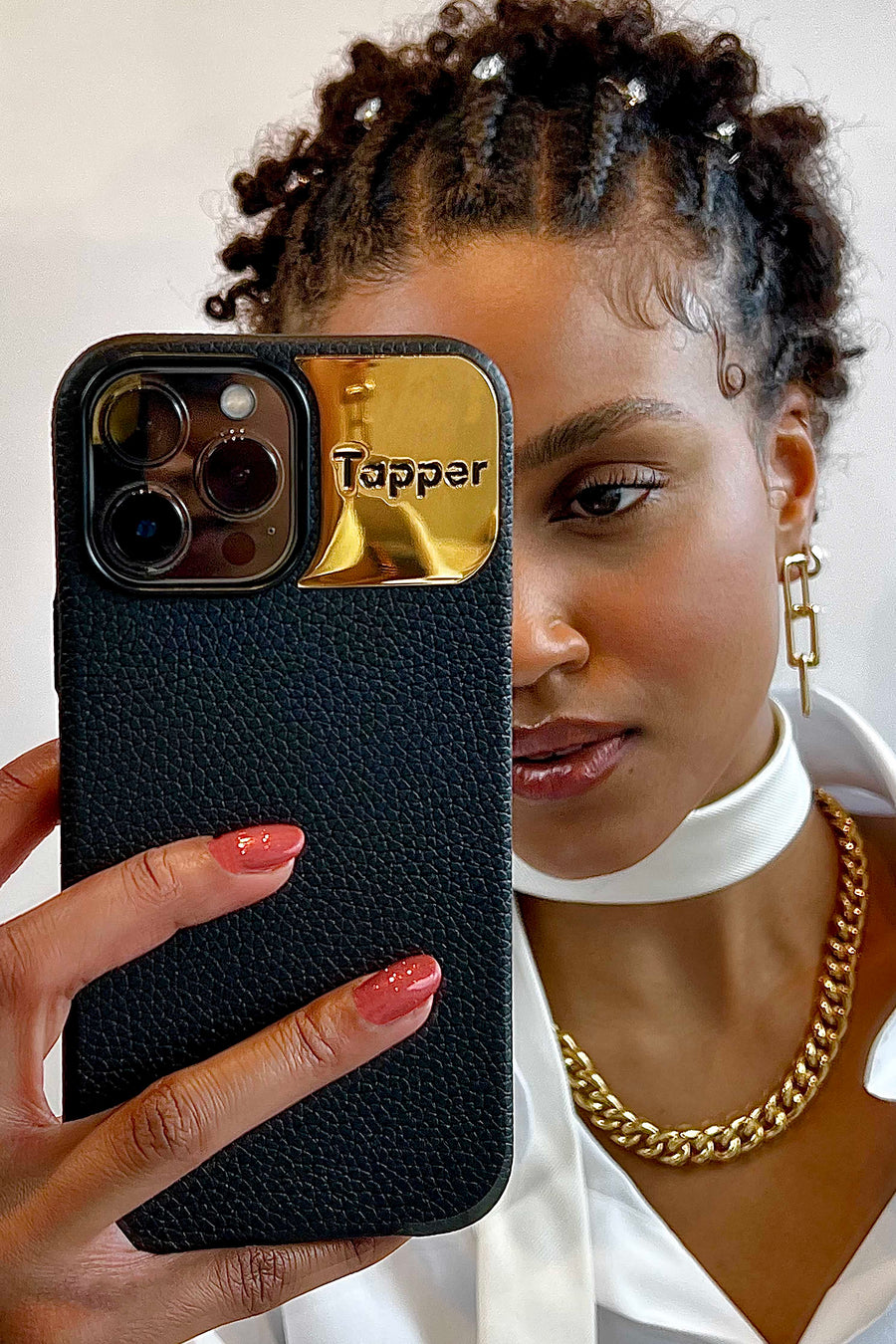 Tapper's luxurious black genuine cow leather iPhone 13 Pro case with MagSafe and a metal logo plate in 18k gold plating that protects and elevates the look of your iPhone 13 Pro. The next must-have high end protective Apple iPhone accessory in real leather and precious metals.  Designed in Sweden by Tapper. Free Express Shipping at gettapper.com