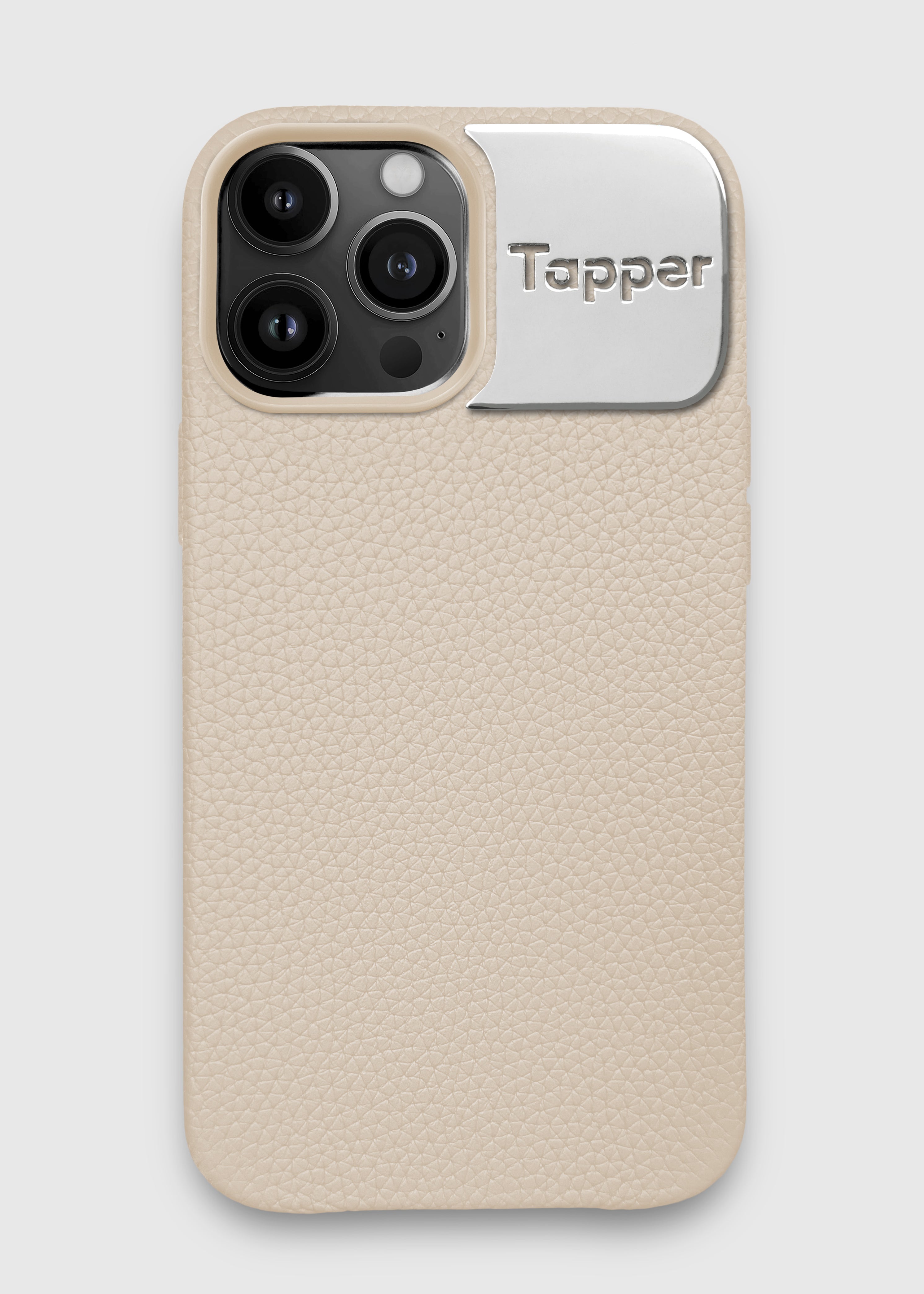 Tapper's luxurious limited edition all sand genuine cow leather iPhone 13 Pro Max case with MagSafe and a metal logo plate colored in silver that protects and elevates the look of your iPhone 13 Pro Max. The next must-have high end protective beige Apple iPhone accessory in real leather and metal details. Limited edition with sand camera frame. Designed in Sweden by Tapper. Free Express Shipping at gettapper.com