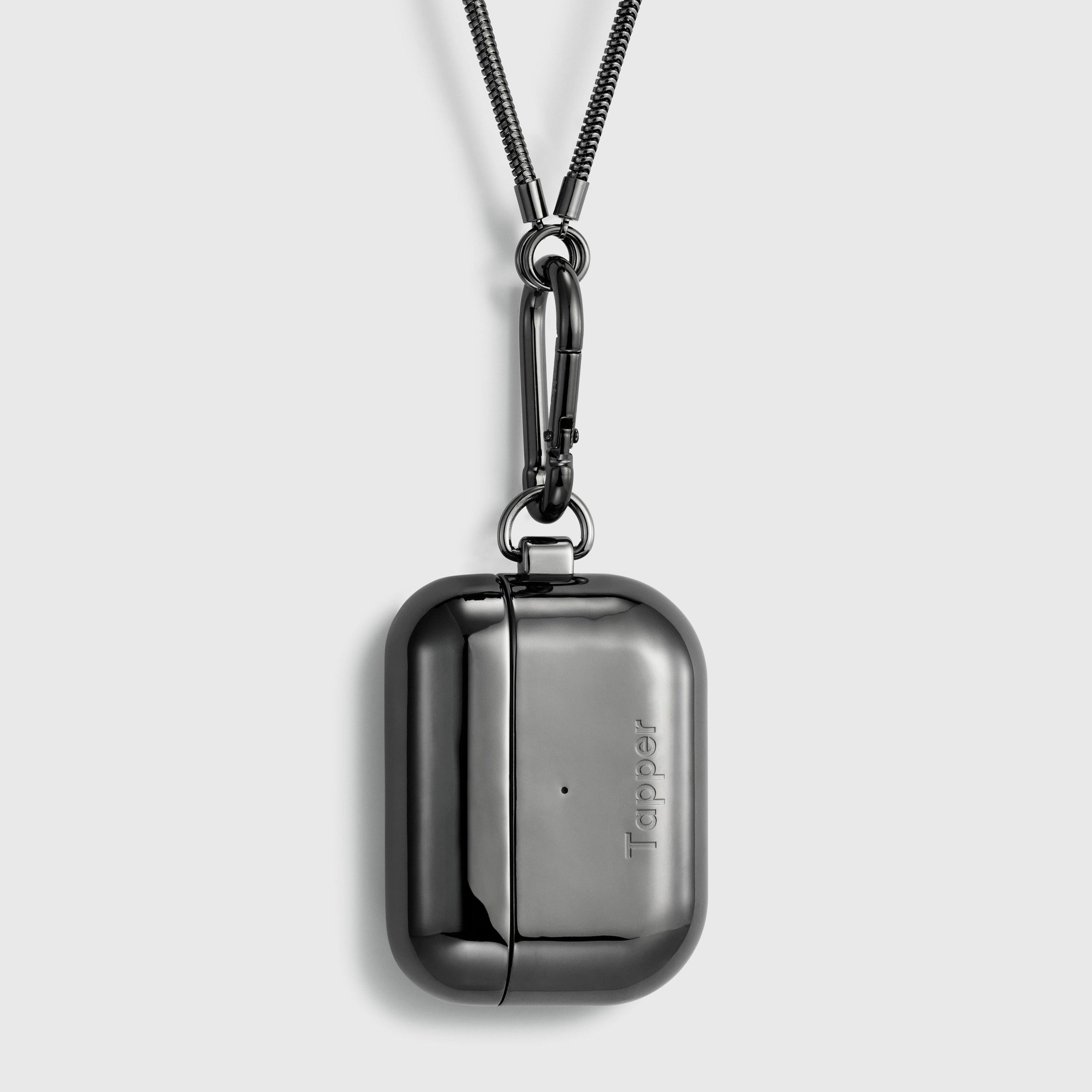 Tapper's real hematite black plated original metal neck case tech jewelry protects and keeps your Apple AirPods Pro close at hand. The luxurious, elevated and accessible neck case plated in precious metals steps up your AirPods Pro jewellery game. Worried about losing your AirPods? Detachable snake chain and carabiner for convenient and hassle-free safekeeping around your neck. The next must-have accessory crafted for ultimate luxury. Compatible with AirPods Pro. Designed in Sweden. Free Express Shipping.