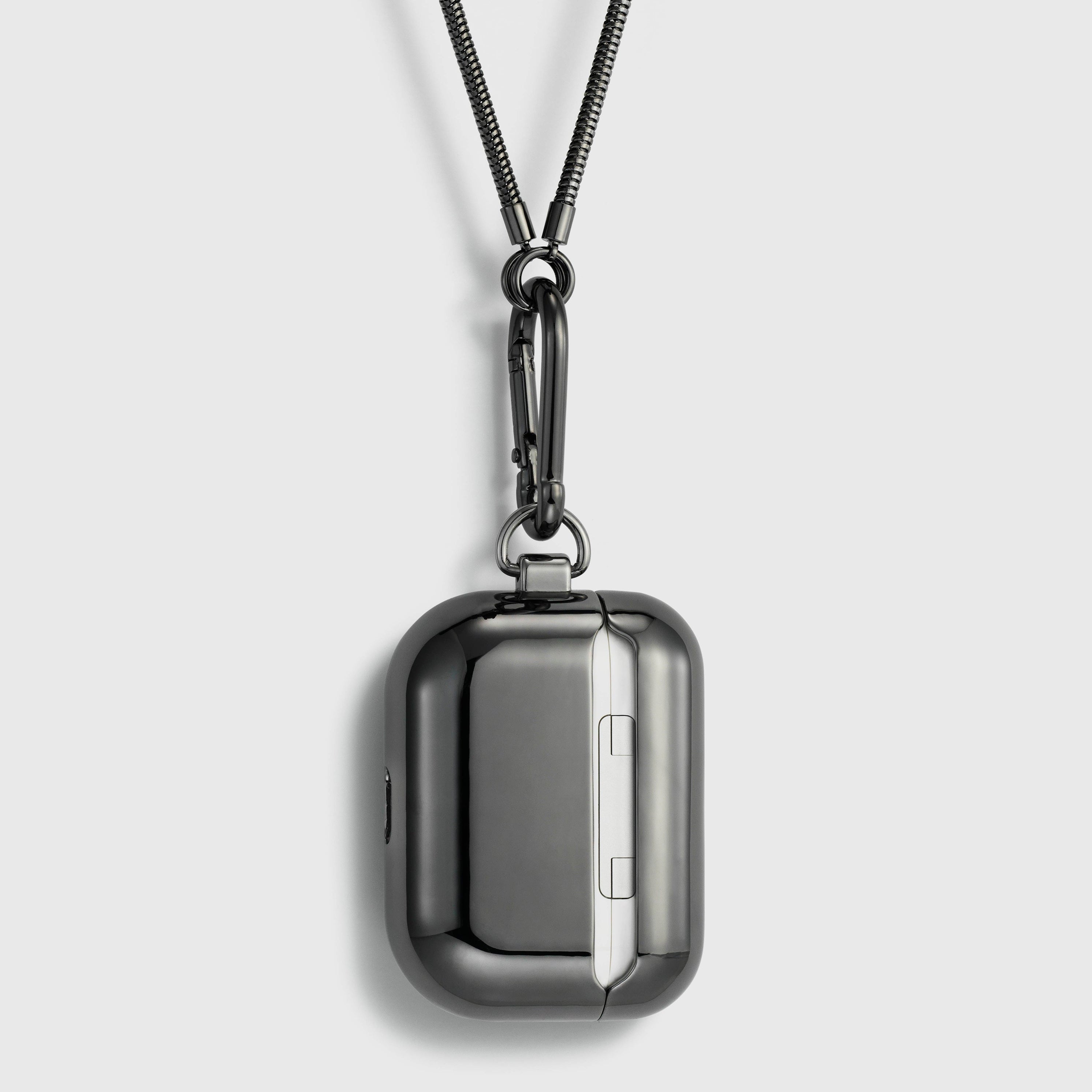 Tapper's real hematite black plated original metal neck case tech jewelry protects and keeps your Apple AirPods Pro close at hand. The luxurious, elevated and accessible neck case plated in precious metals steps up your AirPods Pro jewellery game. Worried about losing your AirPods? Detachable snake chain and carabiner for convenient and hassle-free safekeeping around your neck. The next must-have accessory crafted for ultimate luxury. Compatible with AirPods Pro. Designed in Sweden. Free Express Shipping.