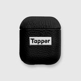 Tapper's luxurious black genuine lamb leather AirPods case protects and elevates the look of your AirPods. The luxurious, protective case for AirPods with a metal logo plate colored in silver steps up your AirPods game. The next must-have high end protective Apple AirPods accessory in real leather and metal details. Compatible with AirPods (1st and 2nd generation). Designed in Sweden by Tapper. Free Express Shipping at gettapper.com