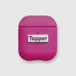 Tapper's luxurious hot pink genuine lamb leather AirPods case protects and elevates the look of your AirPods. The luxurious, protective case for AirPods with a metal logo plate colored in silver steps up your AirPods game. The next must-have high end protective Apple AirPods accessory in bright pink real leather and metal details. Compatible with AirPods (1st and 2nd generation). Designed in Sweden by Tapper. Free Express Shipping at gettapper.com