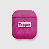 Tapper's luxurious hot pink genuine lamb leather AirPods case protects and elevates the look of your AirPods. The luxurious, protective case for AirPods with a metal logo plate colored in silver steps up your AirPods game. The next must-have high end protective Apple AirPods accessory in bright pink real leather and metal details. Compatible with AirPods (1st and 2nd generation). Designed in Sweden by Tapper. Free Express Shipping at gettapper.com