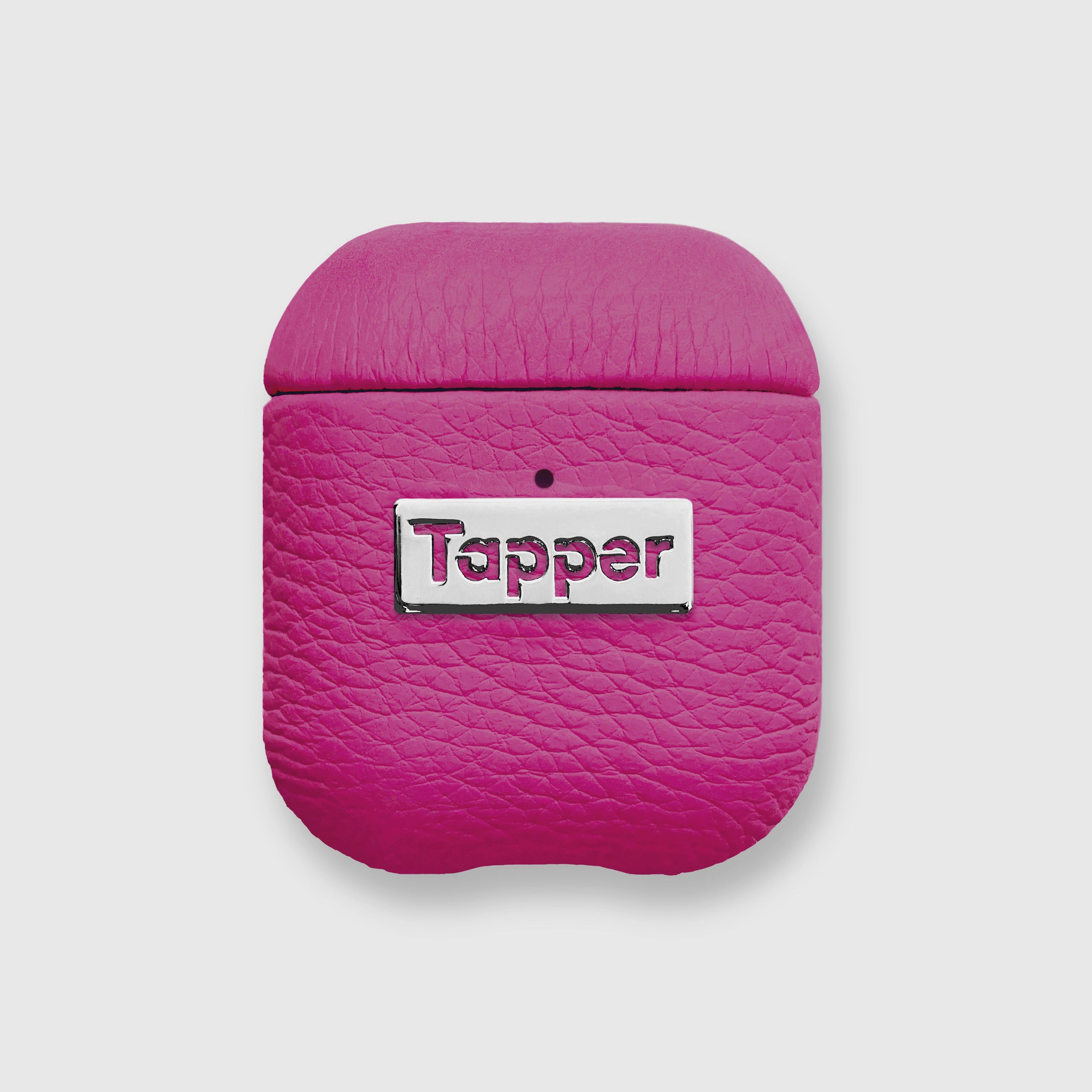 Tapper's luxurious hot pink genuine lamb leather AirPods case protects and elevates the look of your AirPods. The luxurious, protective case for AirPods with a metal logo plate colored in silver steps up your AirPods game. The next must-have high end protective Apple AirPods accessory in bright pink real leather and metal details. Compatible with AirPods (1st and 2nd generation). Designed in Sweden by Tapper. Free Express Shipping at gettapper.com
