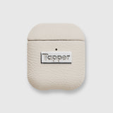 Tapper's luxurious sand beige genuine lamb leather AirPods case protects and elevates the look of your AirPods. The luxurious, protective case for AirPods with a metal logo plate colored in silver steps up your AirPods game. The next must-have high end protective Apple AirPods accessory in real leather and metal details. Compatible with AirPods (1st and 2nd generation). Designed in Sweden by Tapper. Free Express Shipping at gettapper.com