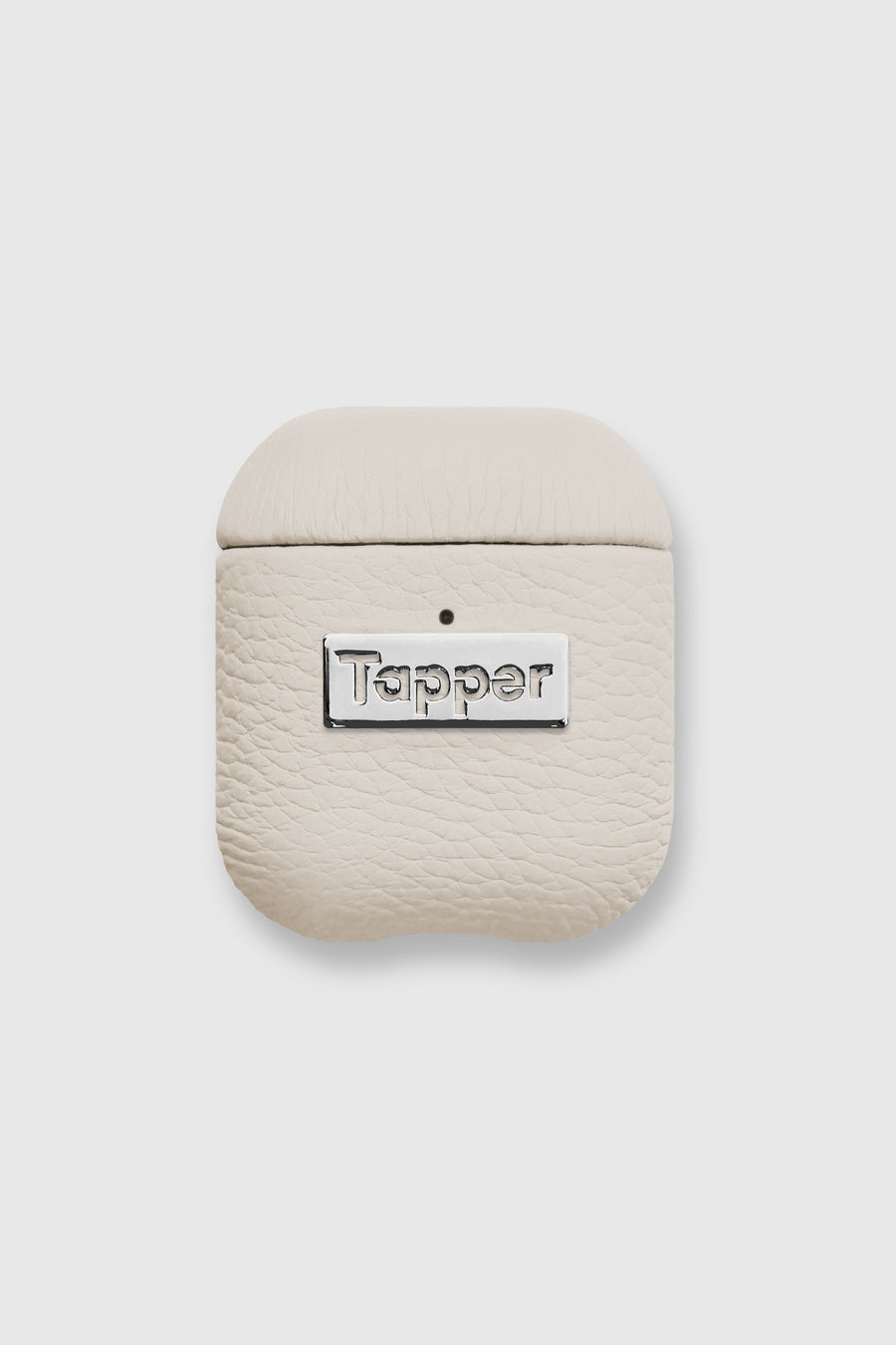 Tapper's luxurious sand beige genuine lamb leather AirPods case protects and elevates the look of your AirPods. The luxurious, protective case for AirPods with a metal logo plate colored in silver steps up your AirPods game. The next must-have high end protective Apple AirPods accessory in real leather and metal details. Compatible with AirPods (1st and 2nd generation). Designed in Sweden by Tapper. Free Express Shipping at gettapper.com
