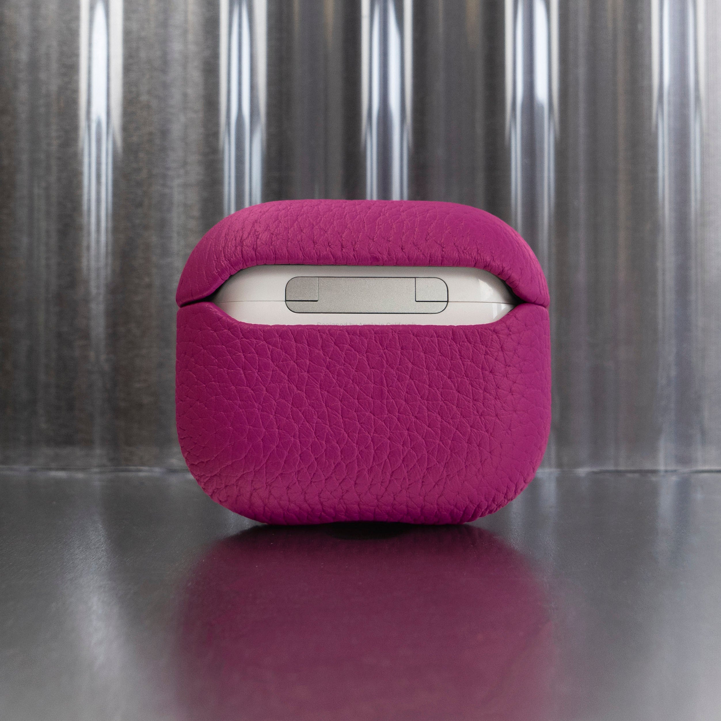 Tapper's luxurious hot pink genuine cow leather AirPods case protects and elevates the look of your AirPods. The luxurious, protective case for AirPods with a metal logo plate colored in silver steps up your AirPods game. The next must-have high end protective Apple AirPods accessory in bright pink real leather with metal details. Compatible with AirPods (3rd generation). Designed in Sweden by Tapper. Free Express Shipping at gettapper.com