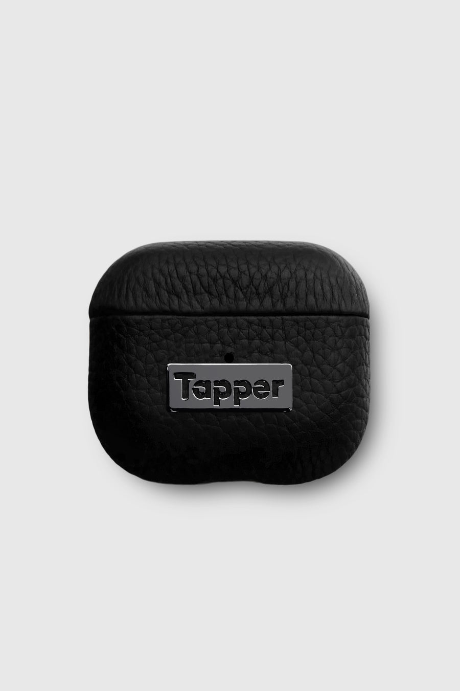 Tapper's luxurious black genuine lamb leather AirPods case protects and elevates the look of your AirPods. The luxurious, protective case for AirPods with a metal logo plate in hematite black plating steps up your AirPods game. The next must-have high end protective Apple AirPods accessory in real leather and precious metals. Compatible with AirPods (3rd generation). Designed in Sweden by Tapper. Free Express Shipping at gettapper.com