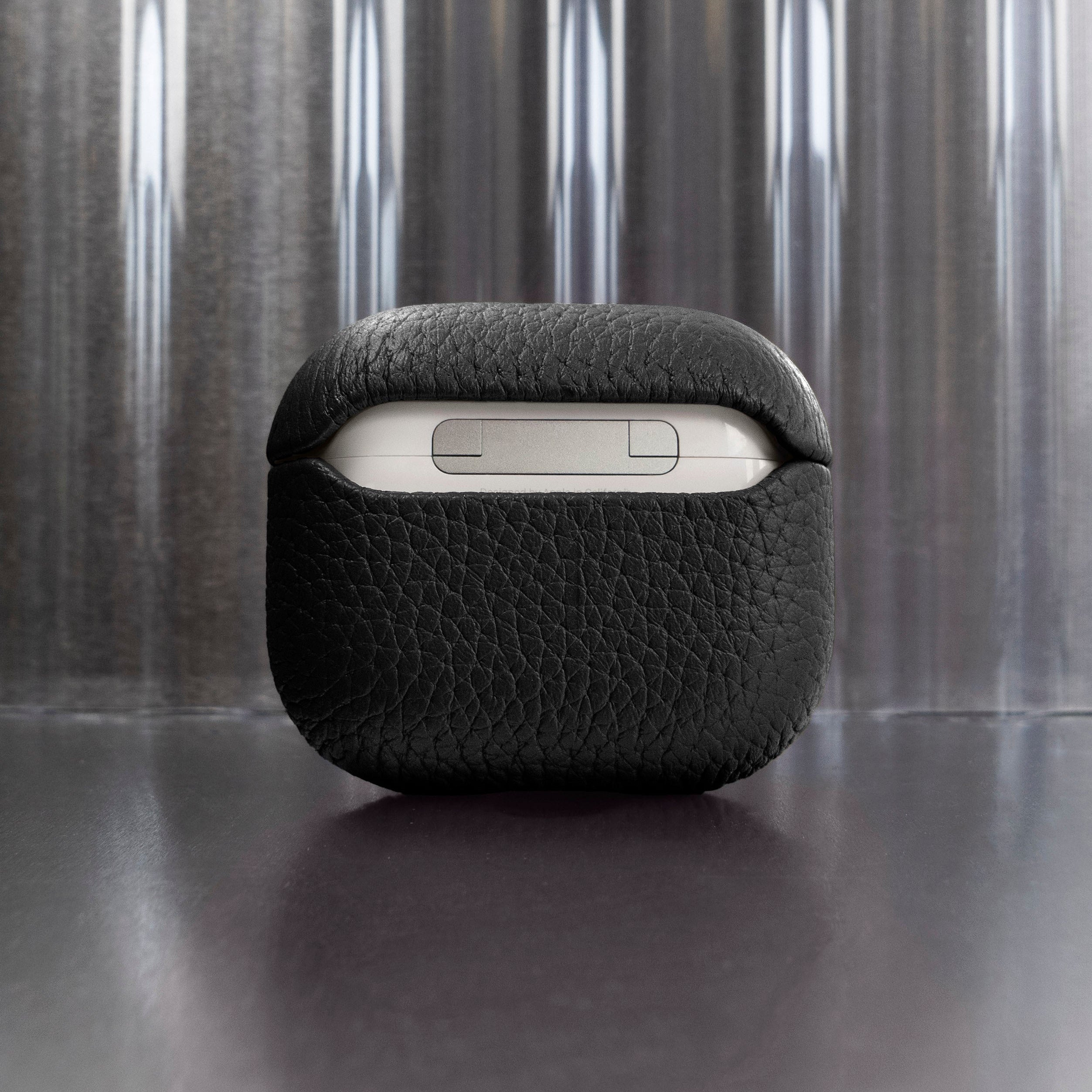 Tapper's luxurious black genuine cow leather AirPods case protects and elevates the look of your AirPods. The luxurious, protective case for AirPods with a metal logo plate in real 18k gold plating steps up your AirPods game. The next must-have high end protective Apple AirPods accessory in real leather and precious metals. Compatible with AirPods (3rd generation). Designed in Sweden by Tapper. Free Express Shipping at gettapper.com