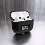 Tapper's luxurious black genuine cow leather AirPods case protects and elevates the look of your AirPods. The luxurious, protective case for AirPods with a metal logo plate in hematite black plating steps up your AirPods game. The next must-have high end protective Apple AirPods accessory in real leather and precious metals. Compatible with AirPods (3rd generation). Designed in Sweden by Tapper. Free Express Shipping at gettapper.com