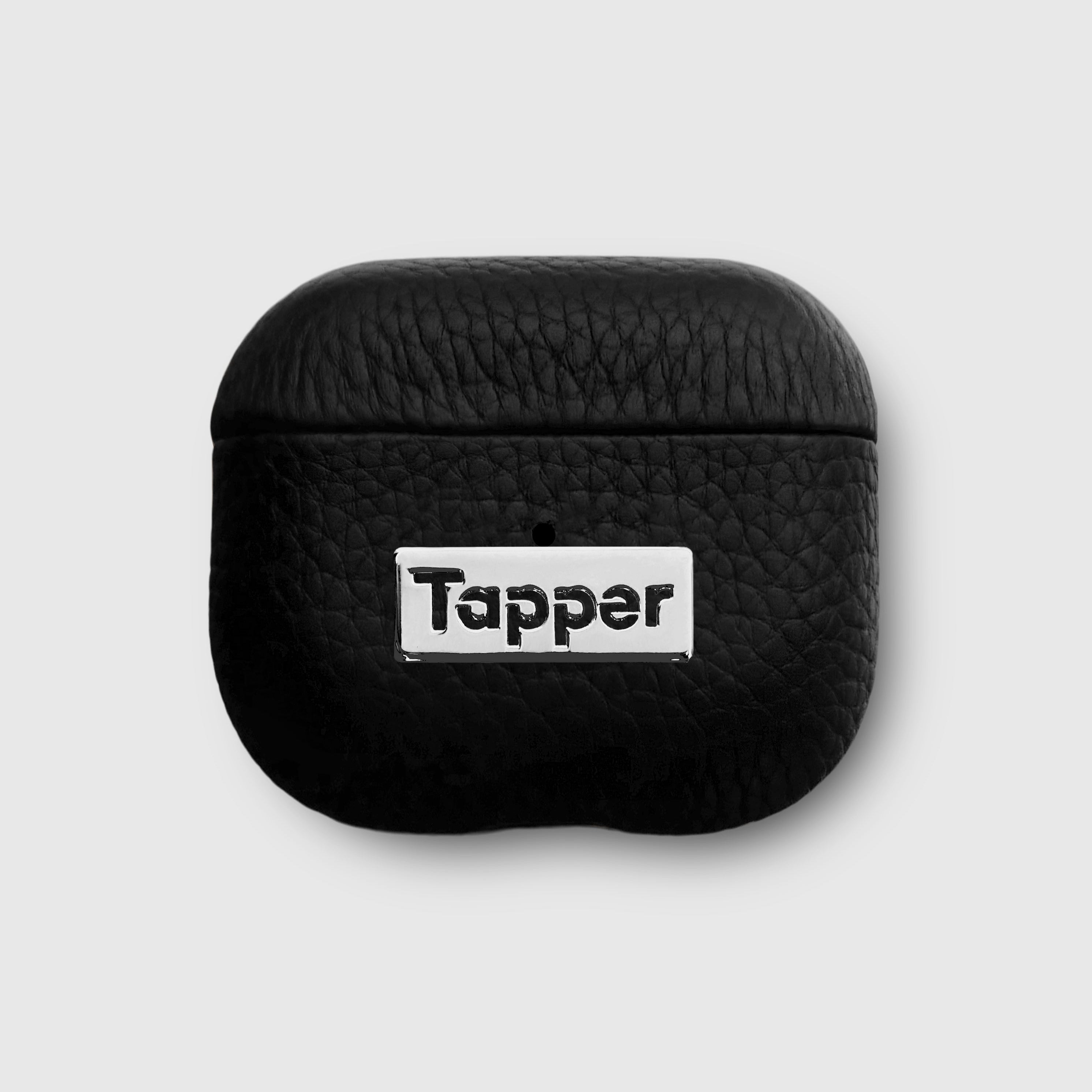 Tapper's luxurious black genuine lamb leather AirPods case protects and elevates the look of your AirPods. The luxurious, protective case for AirPods with a metal logo plate colored in silver steps up your AirPods game. The next must-have high end protective Apple AirPods accessory in real leather with metal details. Compatible with AirPods (3rd generation). Designed in Sweden by Tapper. Free Express Shipping at gettapper.com