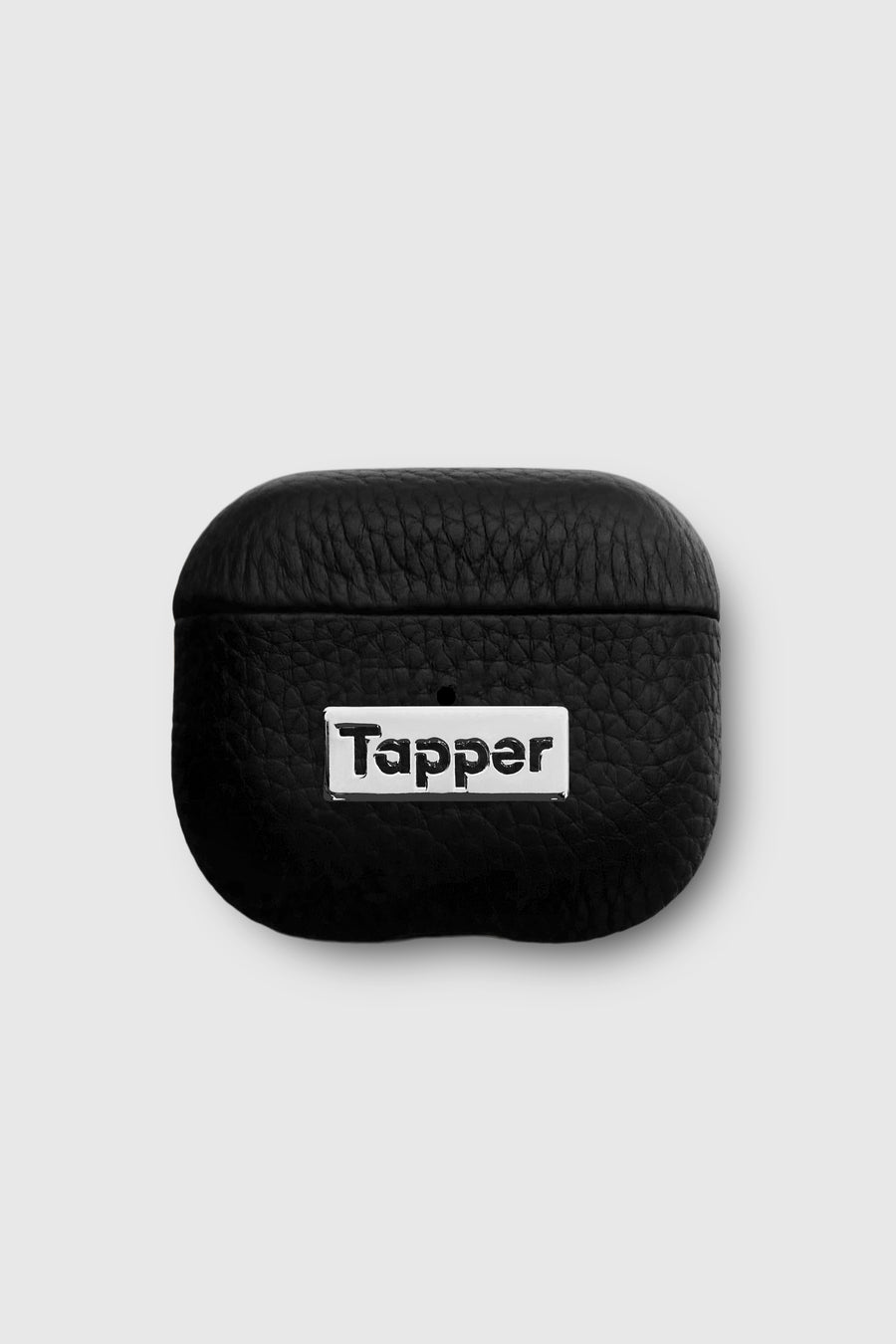 Tapper's luxurious black genuine lamb leather AirPods case protects and elevates the look of your AirPods. The luxurious, protective case for AirPods with a metal logo plate colored in silver steps up your AirPods game. The next must-have high end protective Apple AirPods accessory in real leather with metal details. Compatible with AirPods (3rd generation). Designed in Sweden by Tapper. Free Express Shipping at gettapper.com