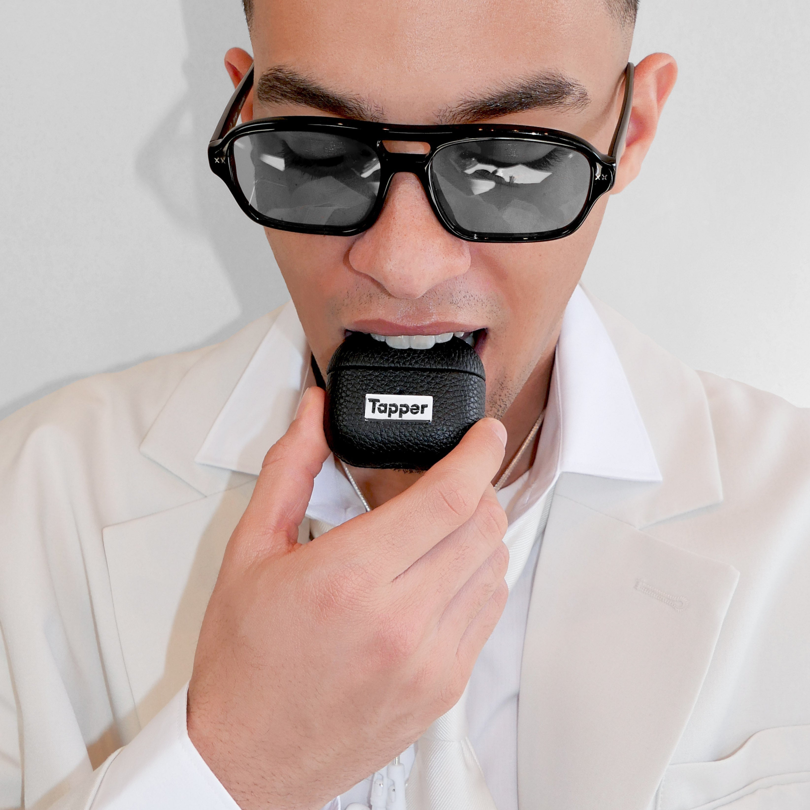 Tapper's luxurious black genuine lamb leather AirPods case protects and elevates the look of your AirPods. The luxurious, protective case for AirPods with a metal logo plate colored in silver steps up your AirPods game. The next must-have high end protective Apple AirPods accessory in real leather with metal details. Compatible with AirPods (3rd generation). Designed in Sweden by Tapper. Free Express Shipping at gettapper.com