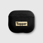 Tapper's luxurious black genuine lamb leather AirPods case protects and elevates the look of your AirPods. The luxurious, protective case for AirPods with a metal logo plate in real 18k gold plating steps up your AirPods game. The next must-have high end protective Apple AirPods accessory in real leather and precious metals. Compatible with AirPods (3rd generation). Designed in Sweden by Tapper. Free Express Shipping at gettapper.com