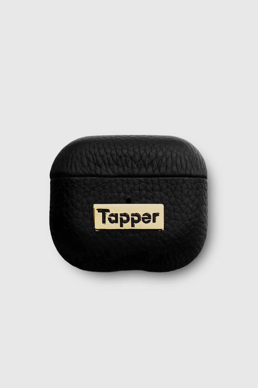 Tapper's luxurious black genuine lamb leather AirPods case protects and elevates the look of your AirPods. The luxurious, protective case for AirPods with a metal logo plate in real 18k gold plating steps up your AirPods game. The next must-have high end protective Apple AirPods accessory in real leather and precious metals. Compatible with AirPods (3rd generation). Designed in Sweden by Tapper. Free Express Shipping at gettapper.com
