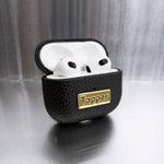 Tapper's luxurious black genuine cow leather AirPods case protects and elevates the look of your AirPods. The luxurious, protective case for AirPods with a metal logo plate in real 18k gold plating steps up your AirPods game. The next must-have high end protective Apple AirPods accessory in real leather and precious metals. Compatible with AirPods (3rd generation). Designed in Sweden by Tapper. Free Express Shipping at gettapper.com