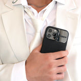 Tapper's luxurious black genuine lamb leather iPhone 13 Pro Max case with MagSafe and a metal logo plate in hematite black plating that protects and elevates the look of your iPhone 13 Pro. The next must-have high end protective Apple iPhone accessory in real leather and precious metals. Designed in Sweden by Tapper. Free Express Shipping at gettapper.com