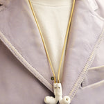 Tapper's solid 18K gold original mesh chain jewelry necklace protects your Apple AirPods & AirPods Pro. Handcrafted in real 18K gold, the exclusive, elevated & accessible mesh chain jewellery snaps the AirPods around your neck. Lost your AirPods? Magnetic lock for convenient and hassle-free safekeeping around your neck. The next must-have & luxe AirPods accessory crafted for ultimate luxury. Compatible with AirPods & AirPods Pro. Designed and handcrafted in Sweden by Tapper. Free Shipping at gettapper.com