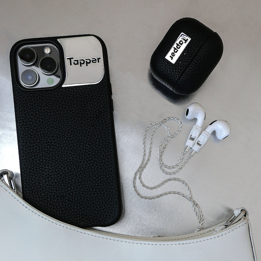 Tapper's luxurious black genuine cow leather AirPods case protects and elevates the look of your AirPods. The luxurious, protective case for AirPods with a metal logo plate colored in silver steps up your AirPods game. The next must-have high end protective Apple AirPods accessory in real leather and metal details. Compatible with AirPods (1st and 2nd generation). Designed in Sweden by Tapper. Free Express Shipping at gettapper.com