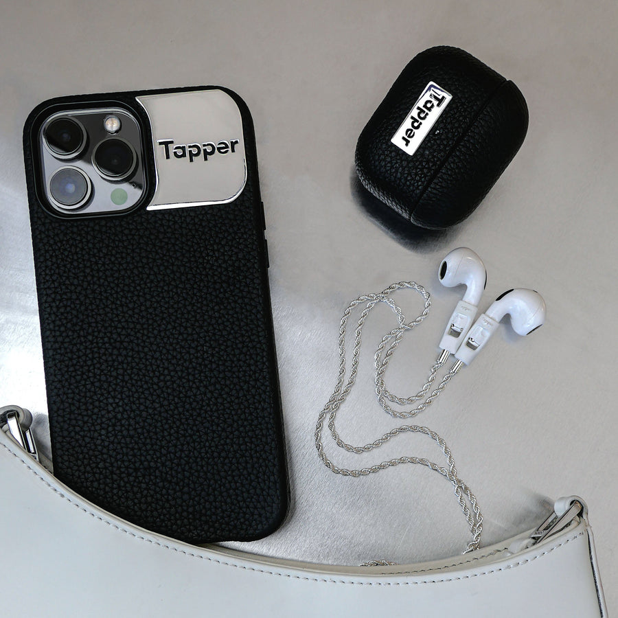 Tapper's luxurious black genuine cow leather AirPods case protects and elevates the look of your AirPods. The luxurious, protective case for AirPods with a metal logo plate colored in silver steps up your AirPods game. The next must-have high end protective Apple AirPods accessory in real leather with metal details. Compatible with AirPods (3rd generation). Designed in Sweden by Tapper. Free Express Shipping at gettapper.com